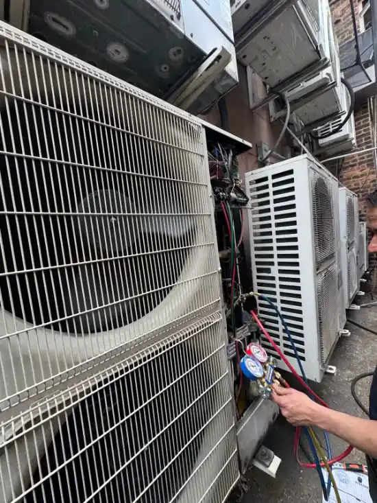 HVAC compressor inspection during a Brooklyn service visit